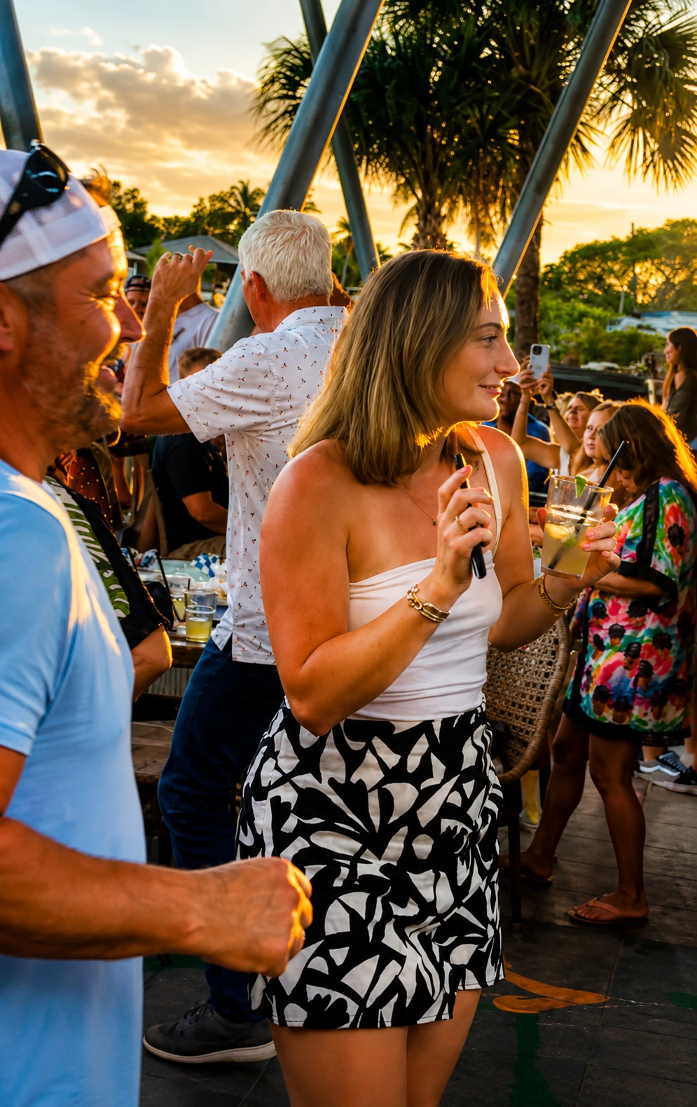 Friends gathering for drinks at Celebration Park Naples waterfront bar